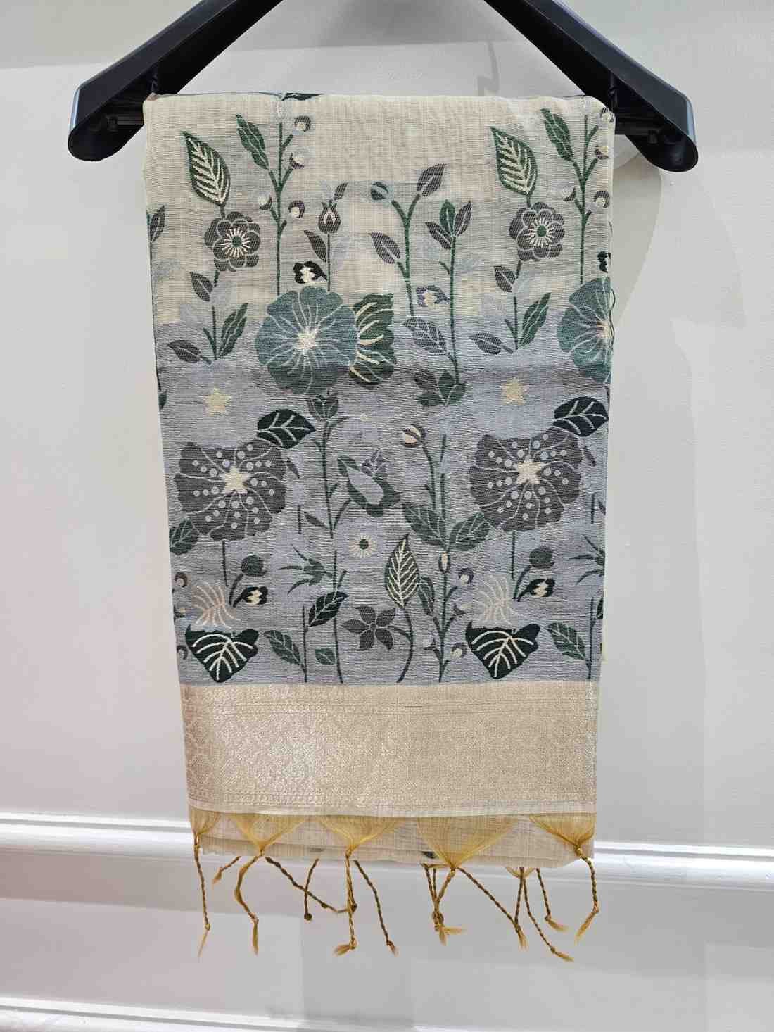 Off white hue with grey floral art muga jamdani saree