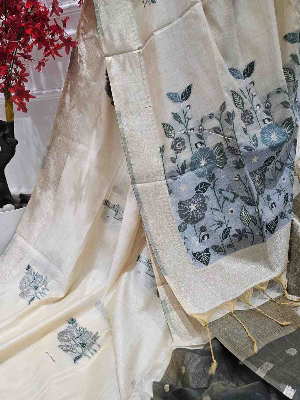 Off white hue with Grey Floral art Muga Jamdani saree